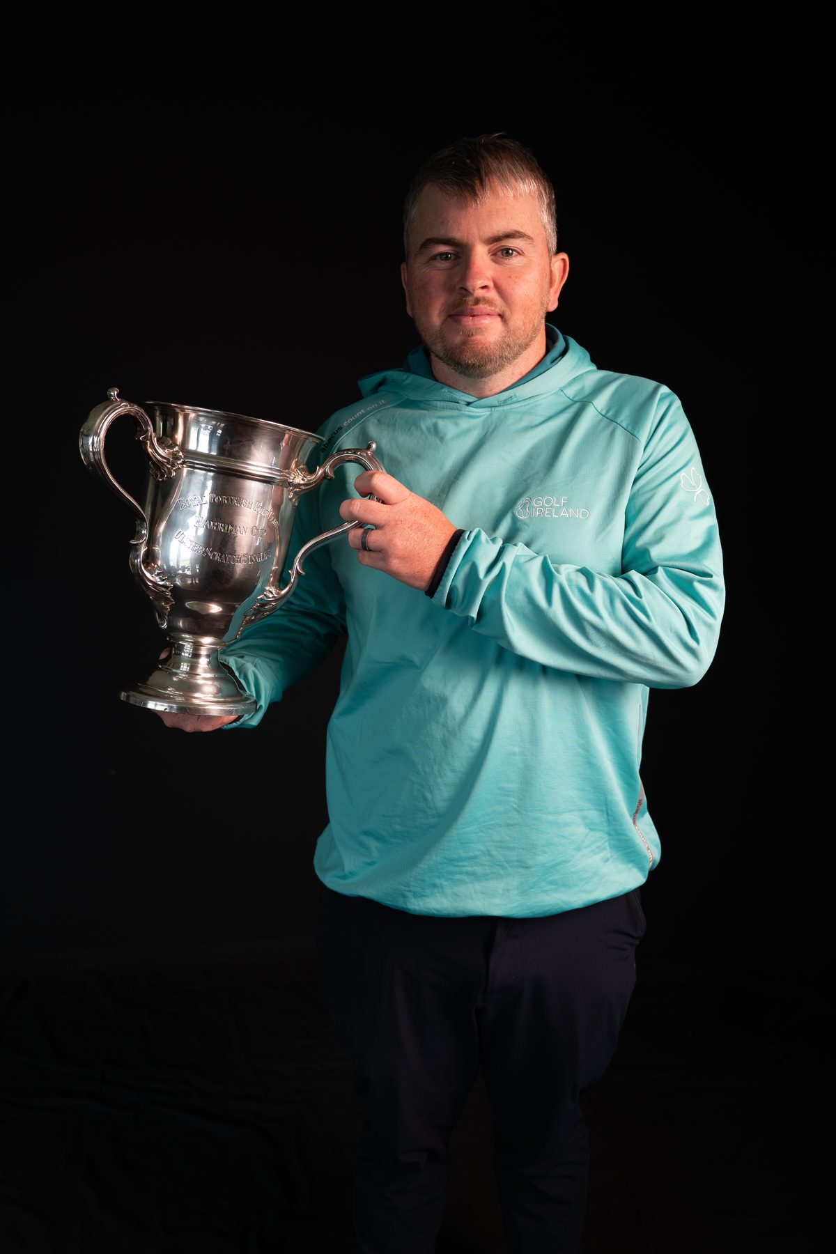 Standing portrait with a trophy, from the Irish Golfer cover shoot