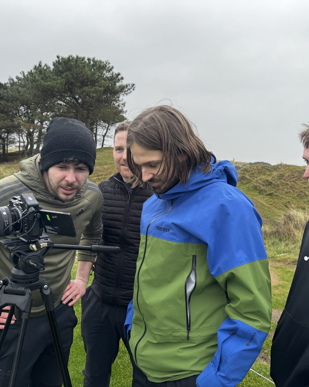 Checking a take on the monitor at a links course shoot for McGuirks Golf